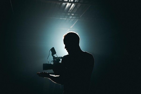 camera man filming in the dark