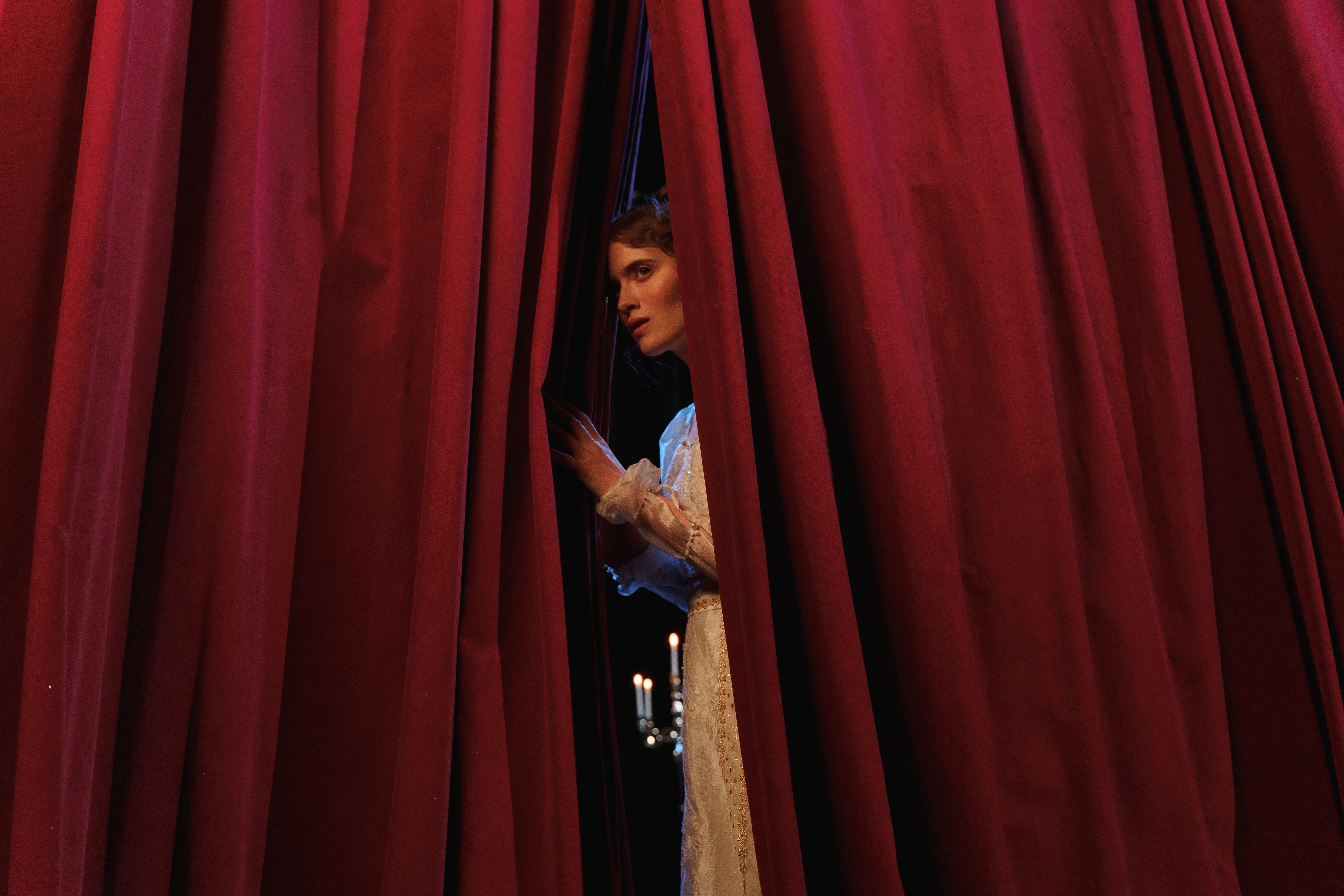 Woman Actress Emerging from Curtain